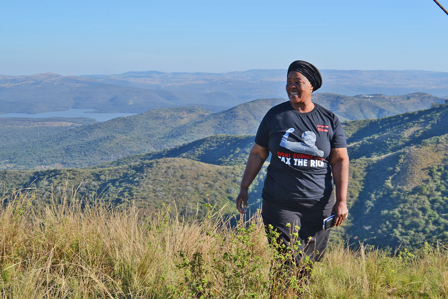 Activist Zimbisule Zulu (Goedertrouw dam in the background) from Matshansundu village.