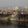 Shanties stand along the bank of Buriganga River.