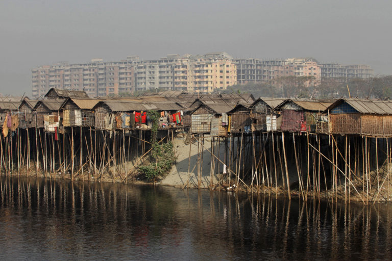 Shanties stand along the bank of Buriganga River.