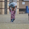 People wading through water.