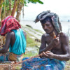 Fishermen making hilsa nets.