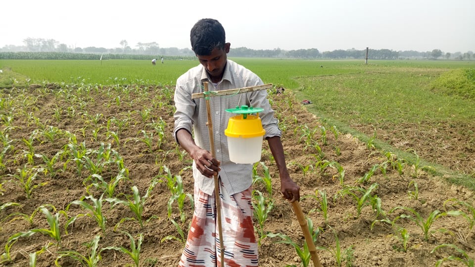 A farmer doing integrated pest control.