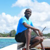 Katana Ngala in a boat during a coral restoration project.