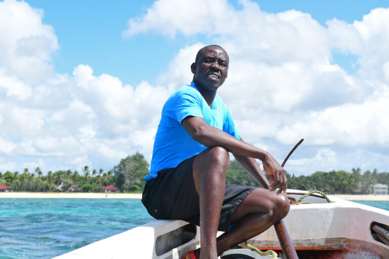 Katana Ngala in a boat during a coral restoration project.