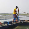 Fishermen going out to the river