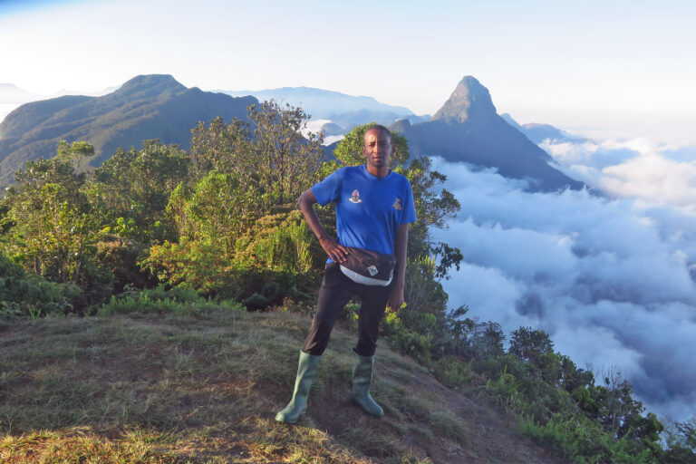 John Lyakurwa poses at Bondwa Peak while doing research in the Uluguru mountains, another massif within the Eastern Arc Mountains.