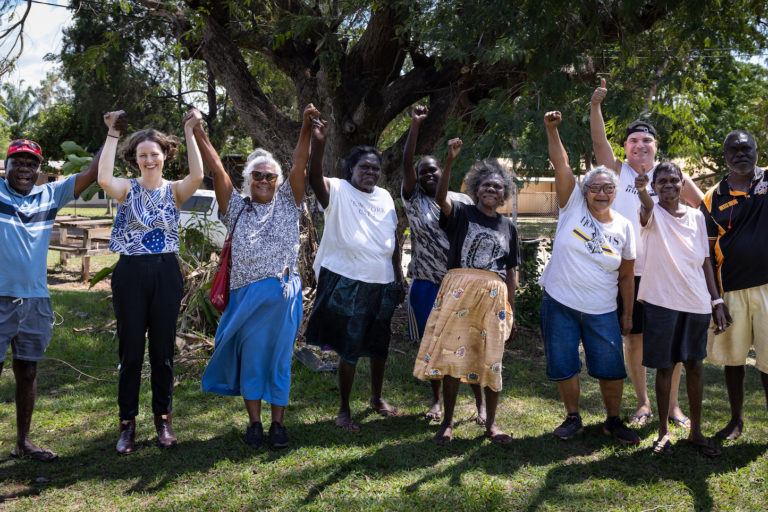 Traditional leaders and indigenous community members including Dennis Tipakalippa, far right, along with EDO Senior Solicitor Jordina Rust, second from left, celebrate their court victory. Image courtesy of Rebecca Parker.