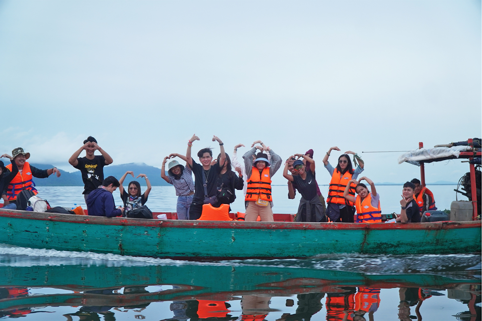 Activists from Mother Nature Cambodia in a boat.