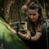 Conservation technology and wildlife manager, Eleanor Flatt, installs a GSM camera trap in the forests protected and managed by Osa Conservation.  Image by Marco Molina.