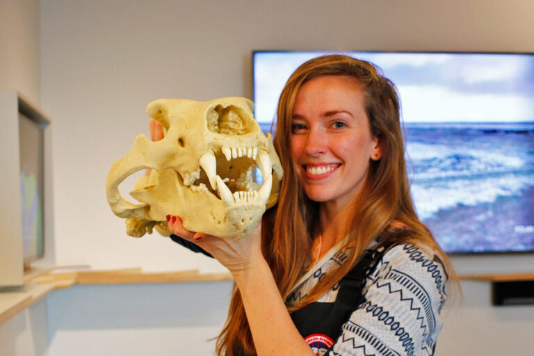 Dickie holds a polar bear skull in Churchill, Manitoba, Canada.